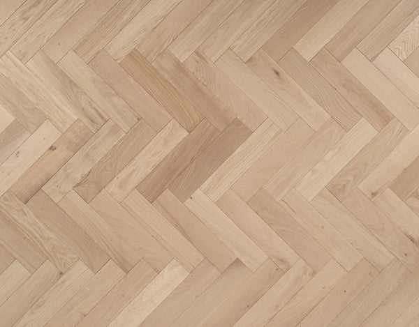 Shore Drift Oak herringbone — brushed and invisible-lacquered oak parquet block