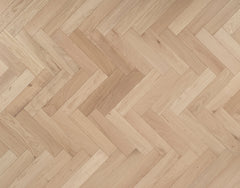 Shore Drift Oak herringbone — brushed and invisible-lacquered oak parquet block